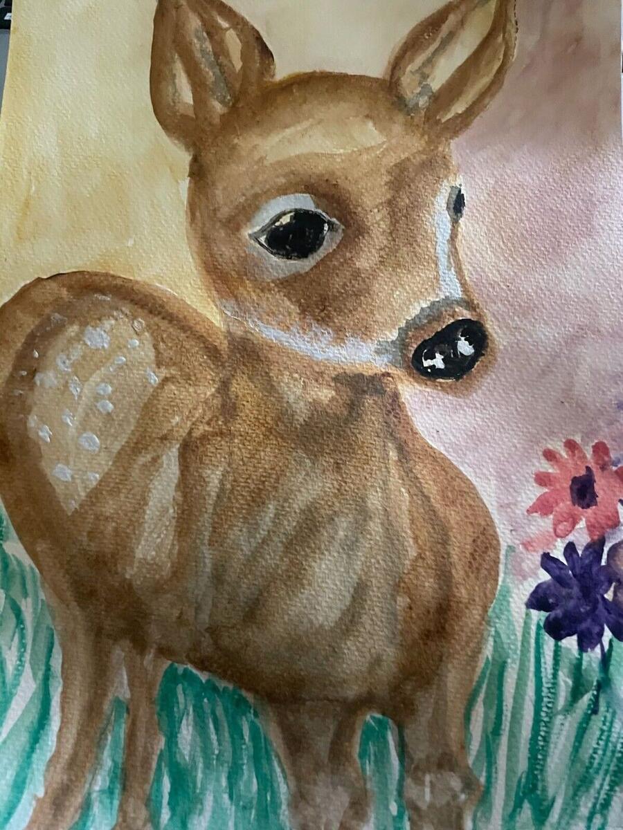 Watercolor of a young spotted fawn with large dark eyes standing in green grass beside red and purple flowers, by Barbara Ballard